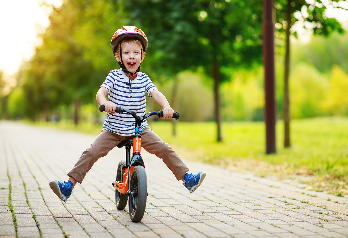 Photo of a happy child on a bike