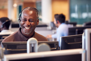 Happy employee with a headset